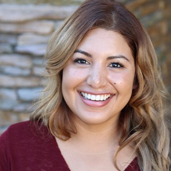 Woman with straight teeth smiling at camera