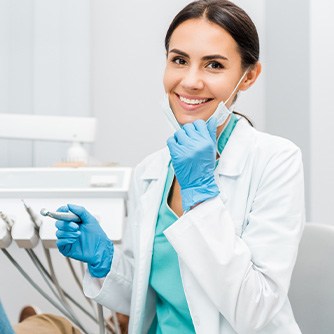 Dentist smiling at patient's dental exam